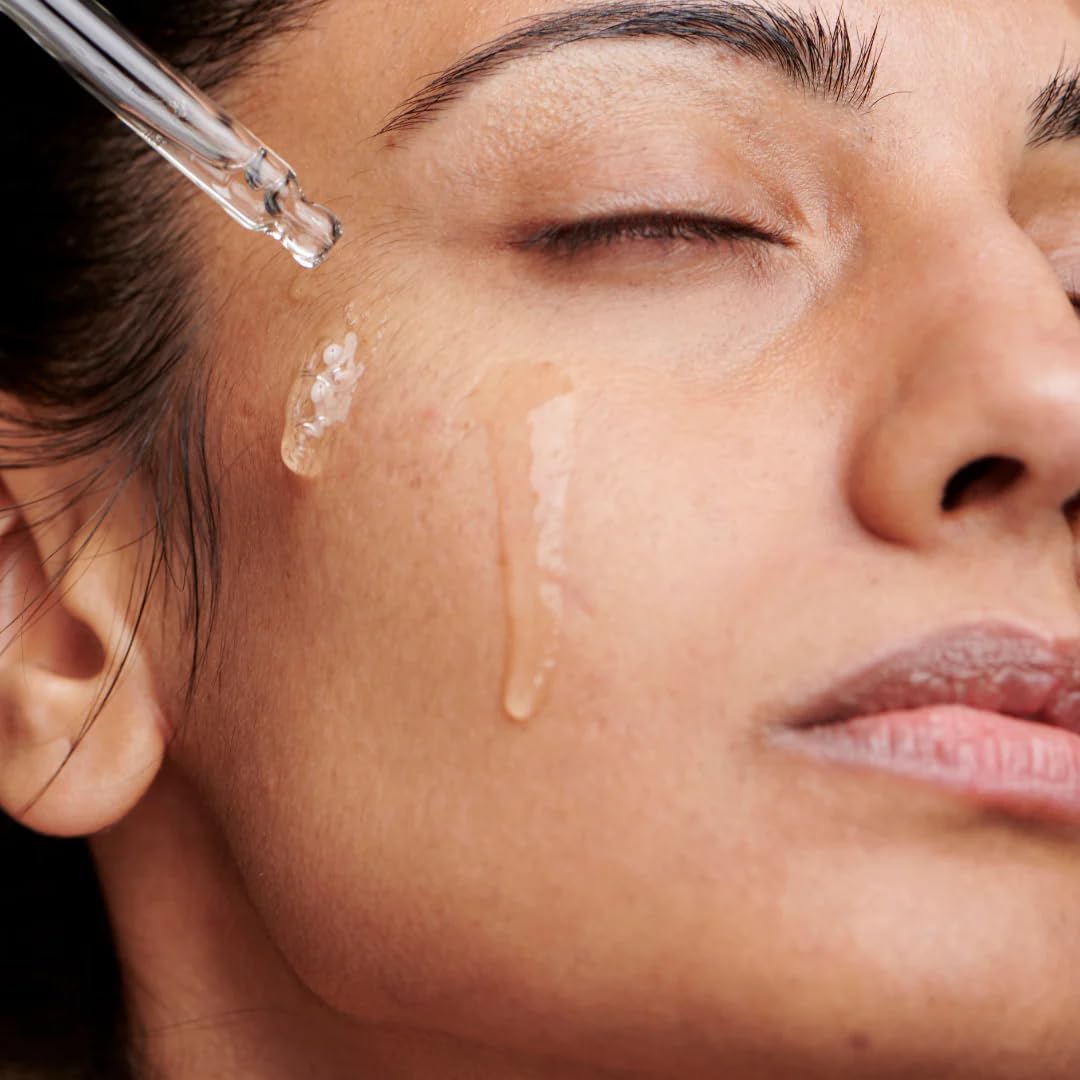 NuOrganic Perfect Eye Serum under-eye application shown for gentle tapping and absorption.