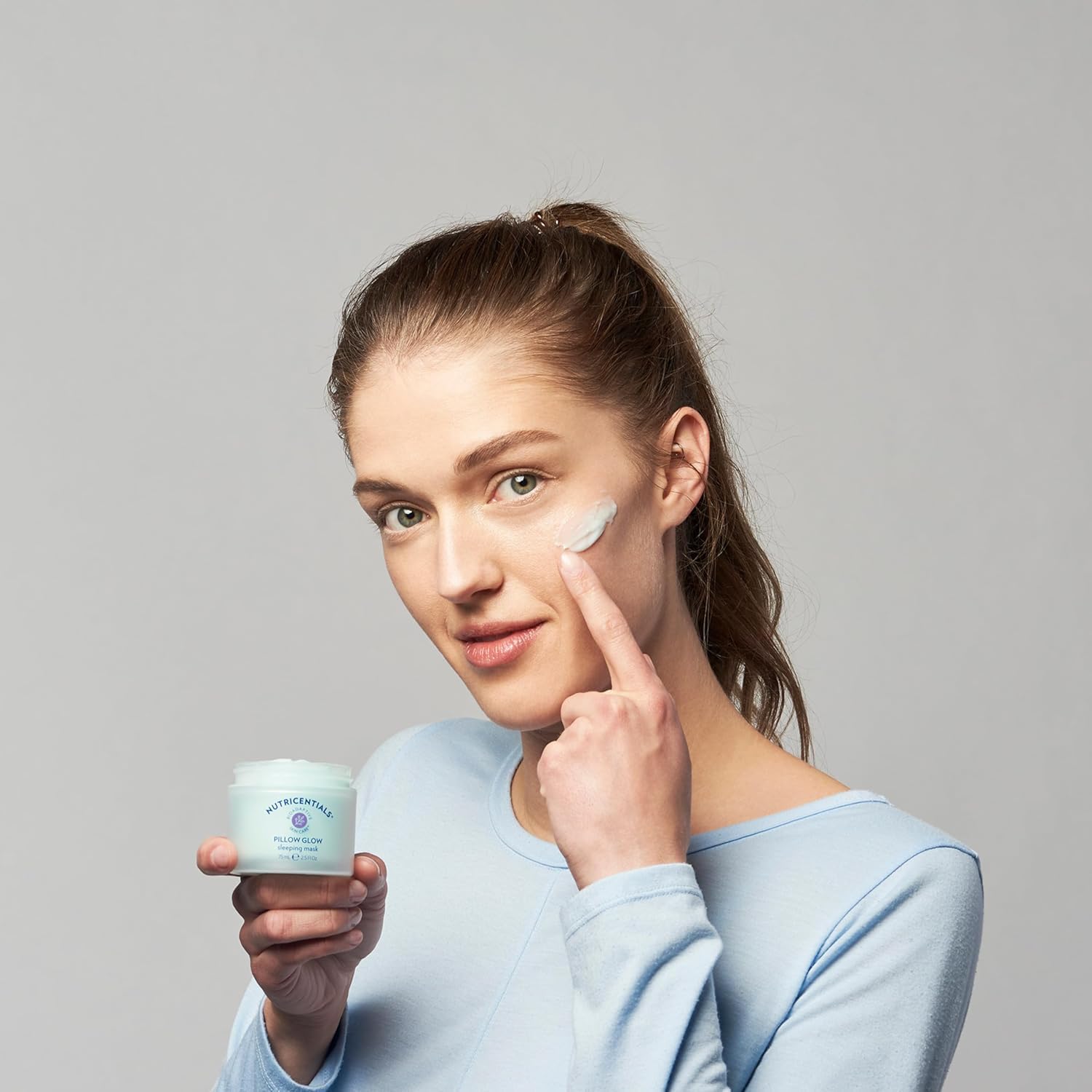 NuSkin Pillow Glow apple extract label signals hydrating nourishment.