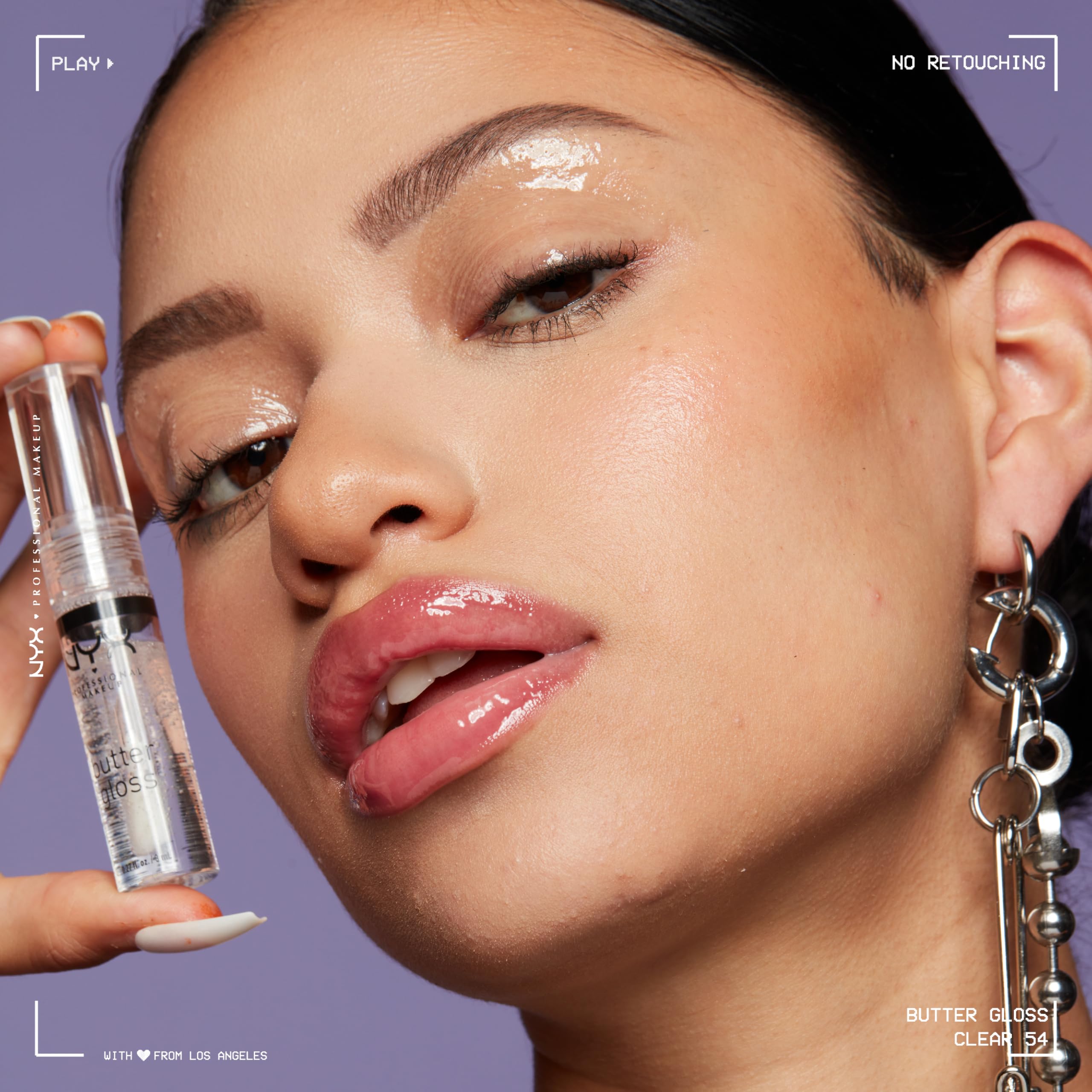 NYX Butter Gloss Sugar Glass on lips for kissable, soft shine.