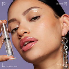 NYX Butter Gloss Sugar Glass on lips for kissable, soft shine.
