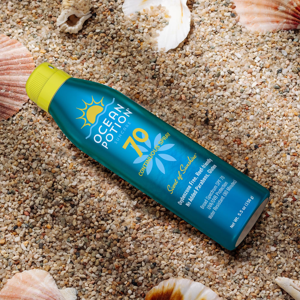 Ocean Potion Sunscreen Body Spray travel-friendly package held in hand.