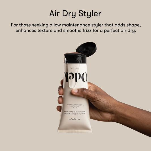 Odele Air Dry Styler gel texture on palm for smoothing strands.
