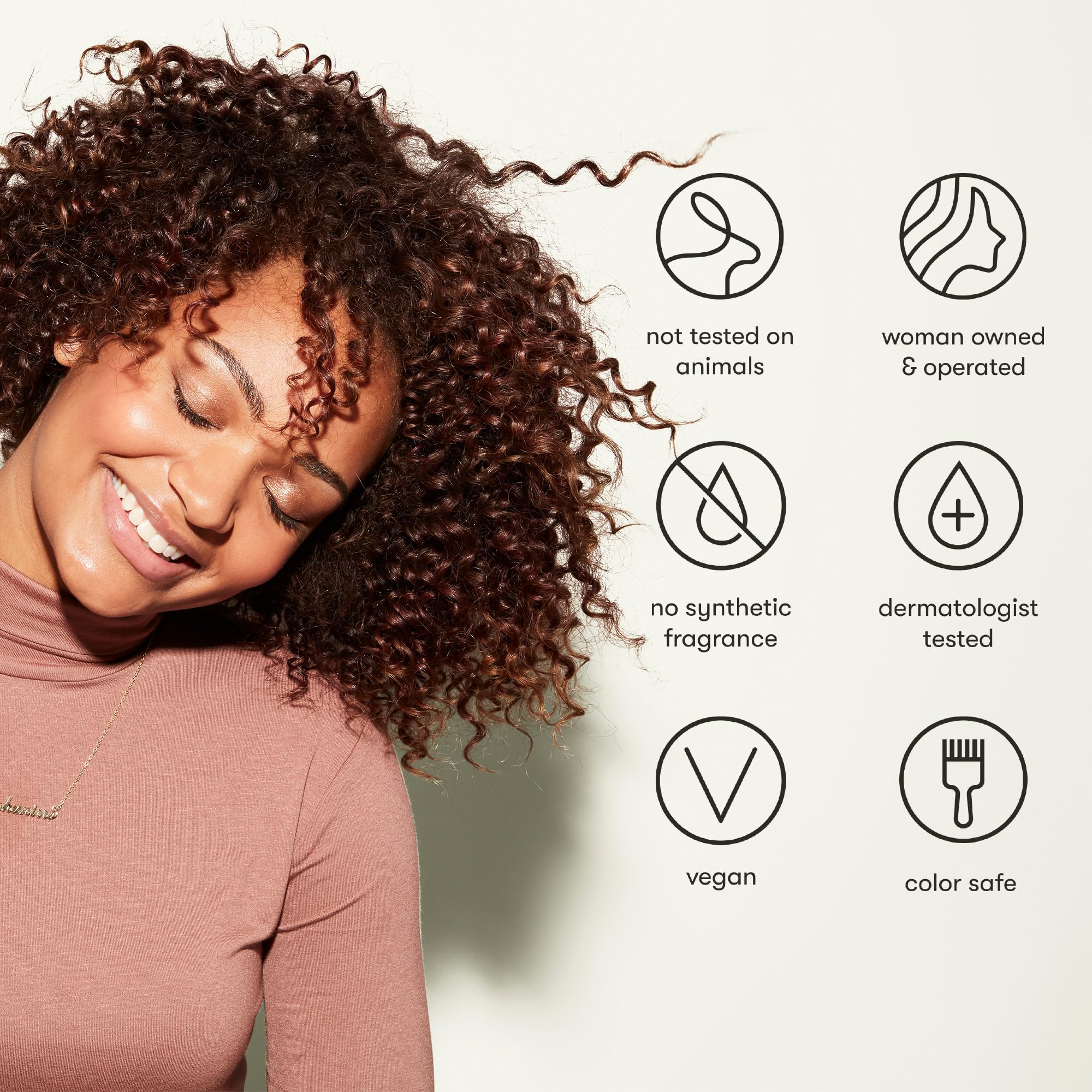 Odele Hair Oil bottle with label emphasizing clean ingredients.