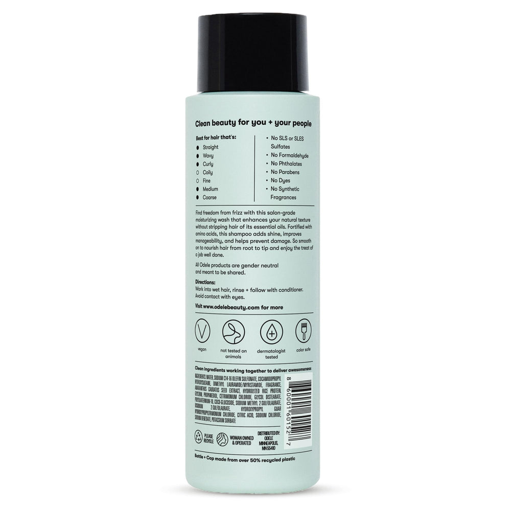 Odele smoothing shampoo flat lay with scent notes of oakmoss, ylang-ylang, cucumber