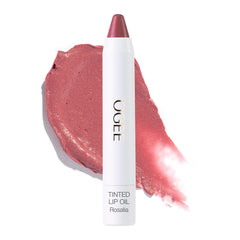 Ogee Rosalia tinted lip oil bottle shows buildable dusty rose color for daily lips.