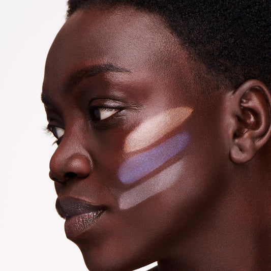 Ogee Shimmer All The Way Amethyst highlighter stick delivering a soft champagne glow for radiant cheeks.