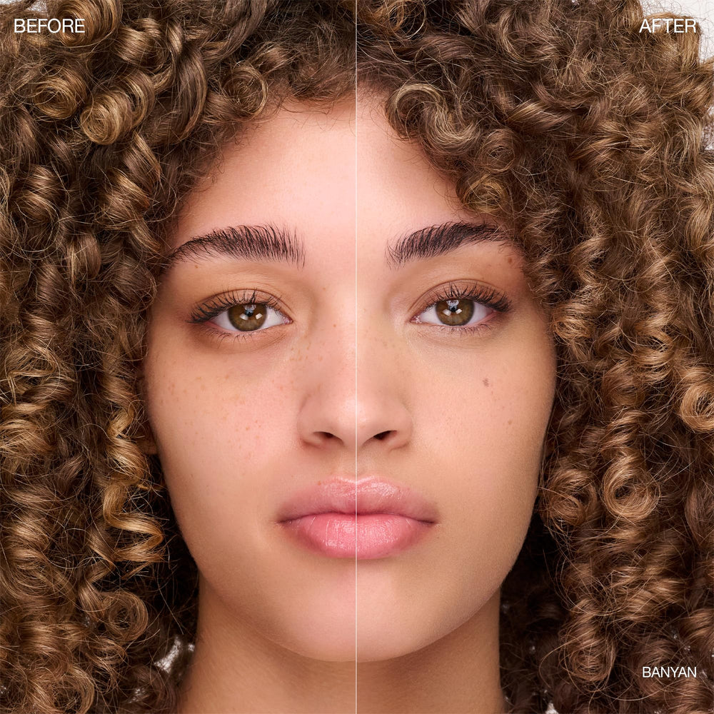 Close-up of applicator applying concealer for precise coverage.