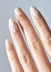Ohora Champagne Glow nail wraps in assorted sizes for a perfect fit.