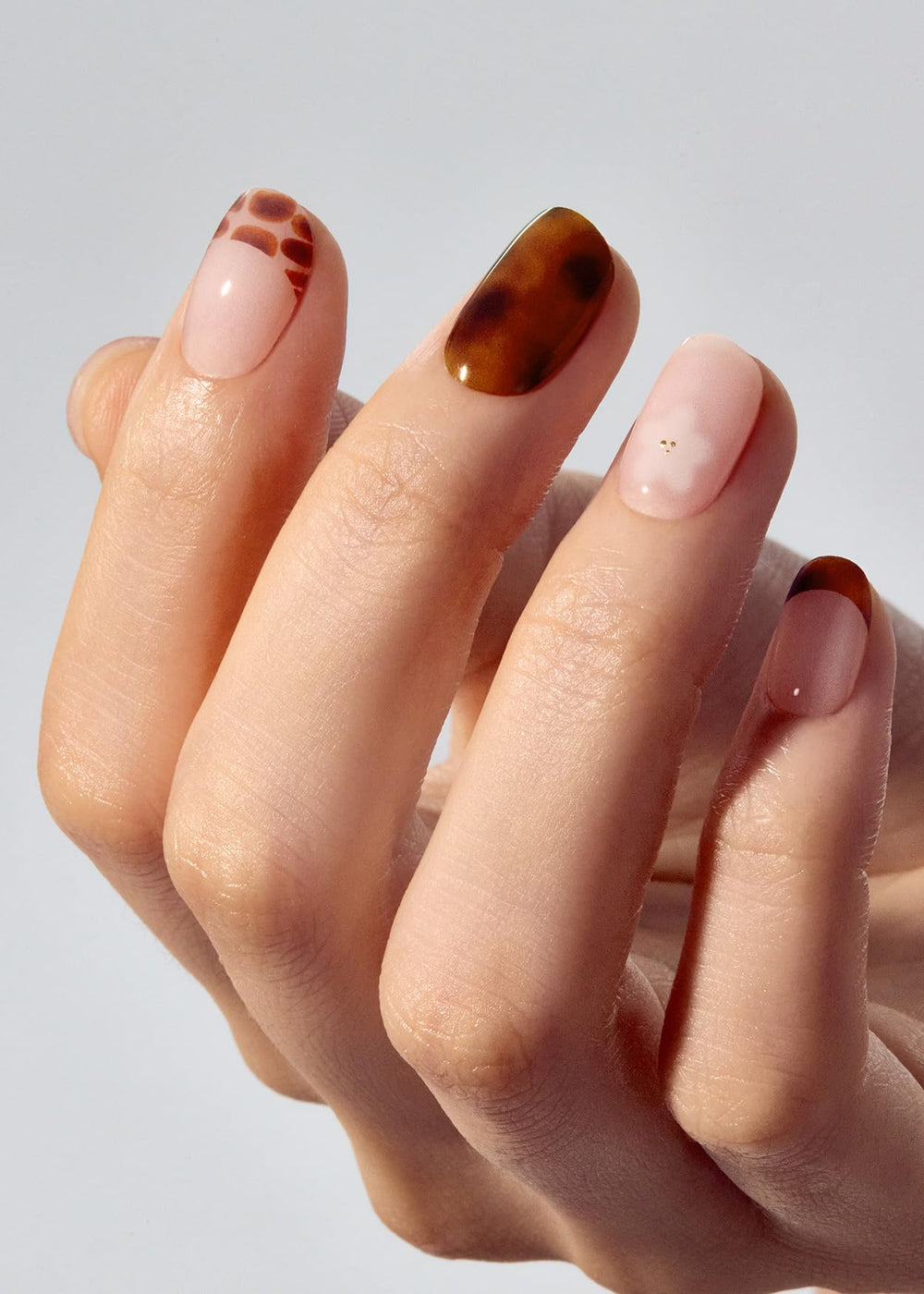 ohora application steps featuring N Tiki Tortoise strips for simple home manicure