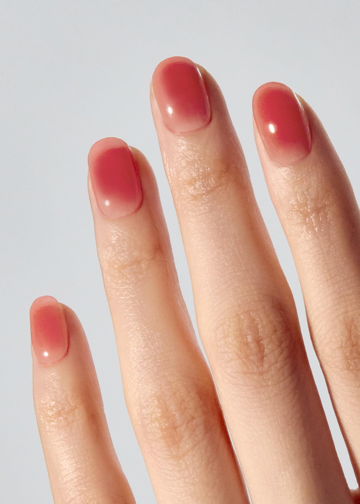 Ohora Peach Jelly strips being applied for easy at-home manicure.