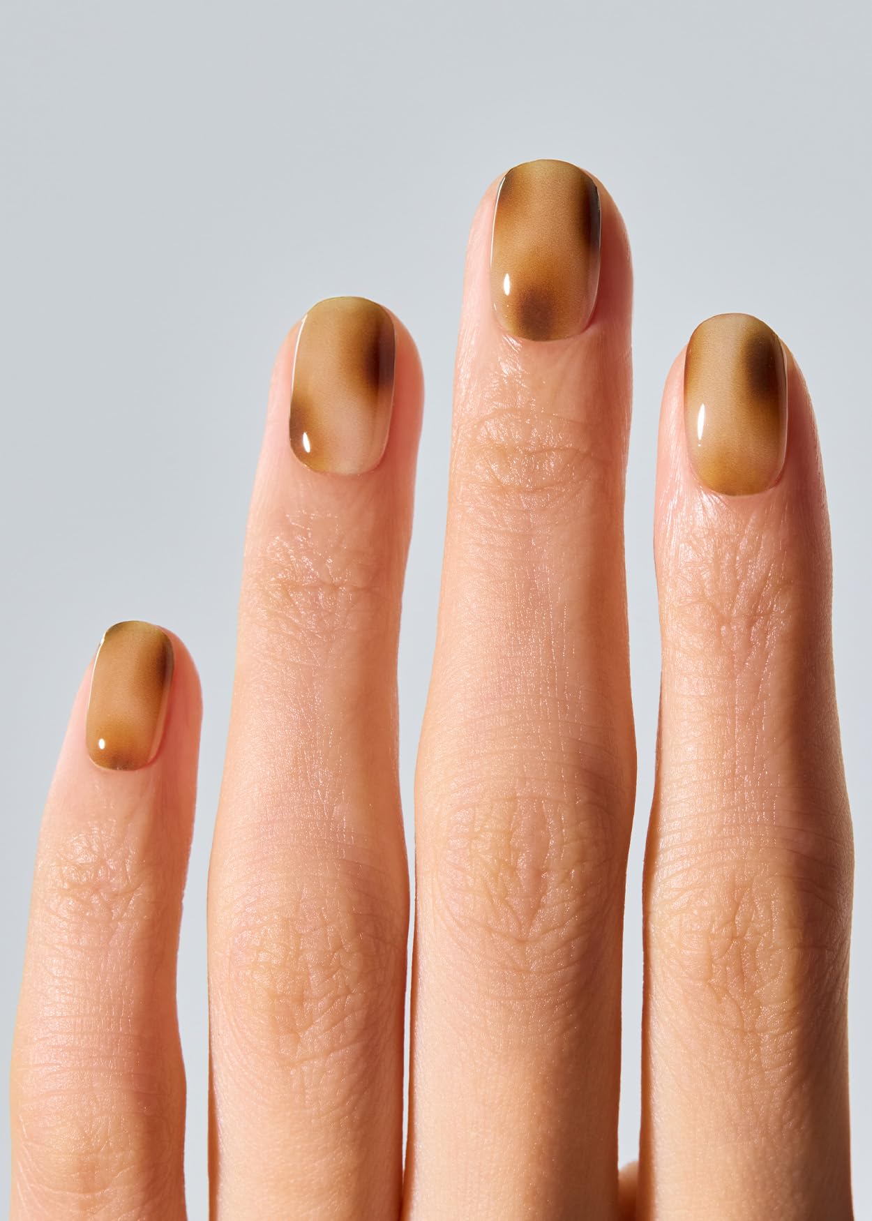 applied ohora Smoky Mocha strips on nails for salon-like results
