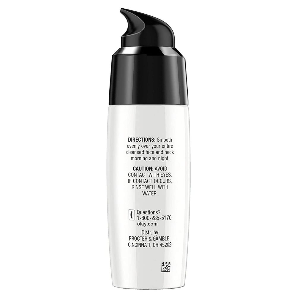 Applying Olay Regenerist serum to the face during daily routine