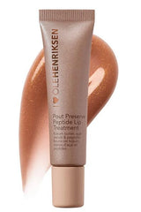 Ole Henriksen Pout Preserve Glimmer Lingonberry Jam on lips provides rich color and luminous glow.
