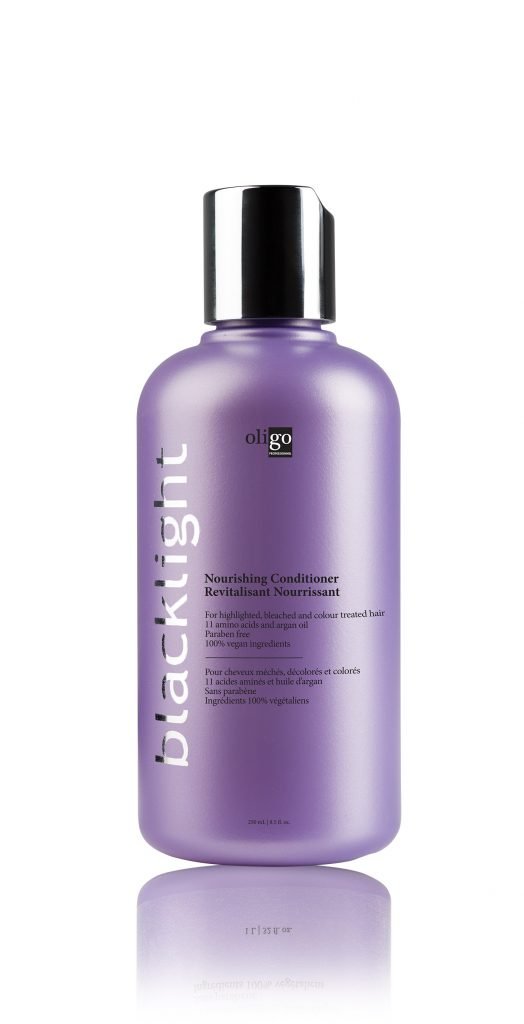 Oligo Blacklight Nourishing Conditioner bottle pour highlights smooth, hydrated blond hair
