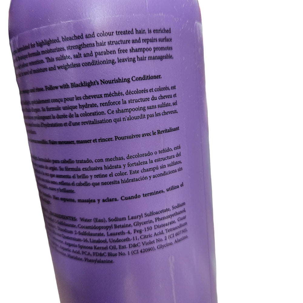 Oligo Professionnel Blacklight shampoo foamy-lather captured during wash.