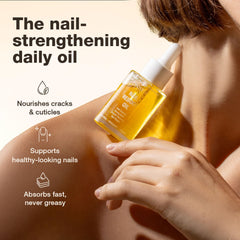 Onsen Secret nail oil being applied to cuticles for hydrated, smooth nails