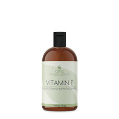 OPO Vitamin E Oil in an amber bottle for skin and hair care.