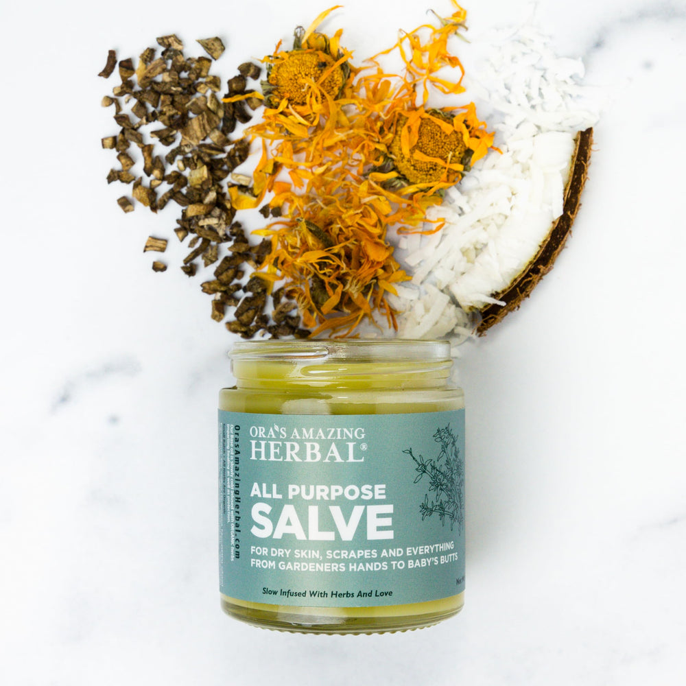 Hands applying Ora's Amazing Herbal salve for daily moisture