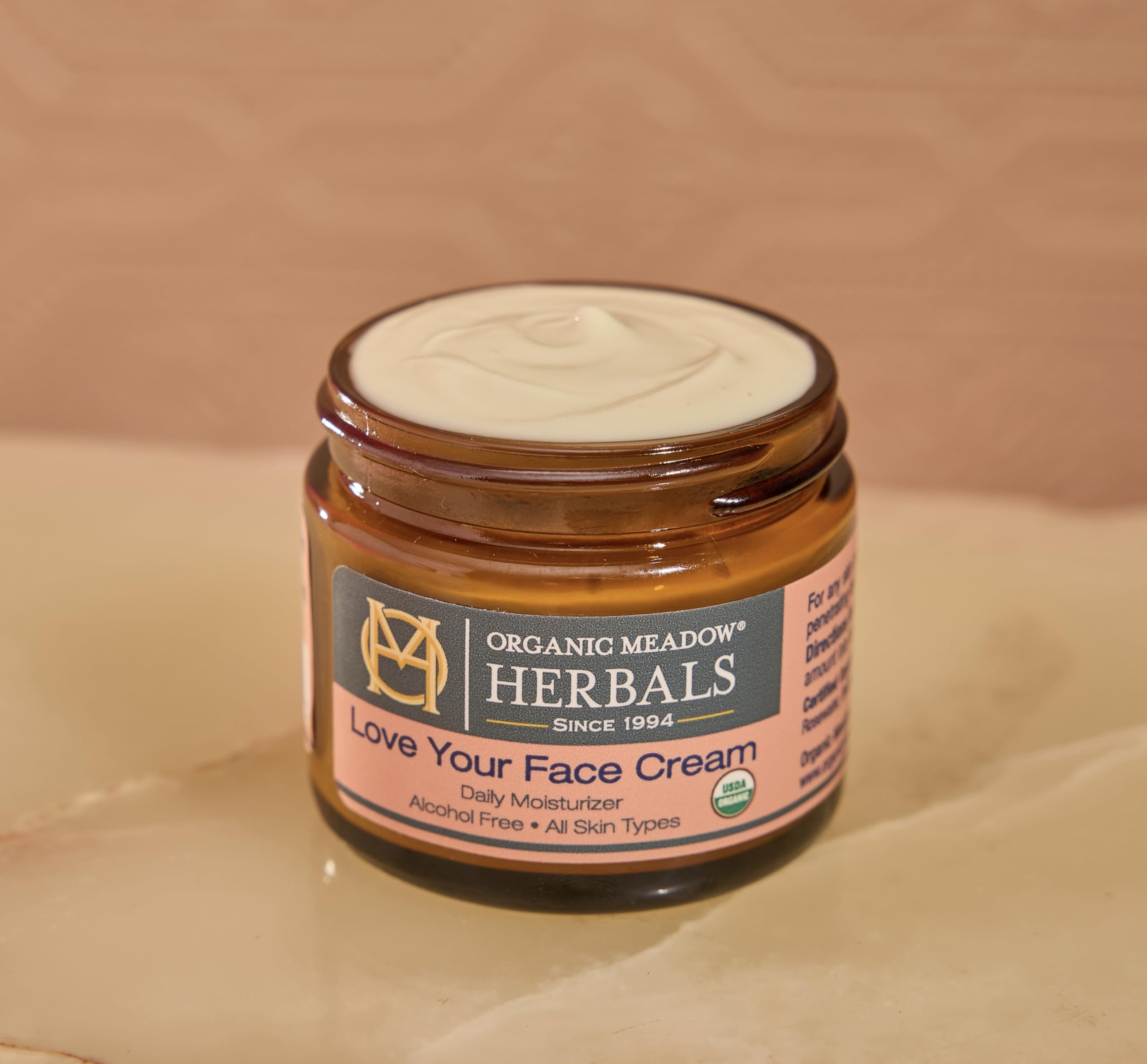 Texture closeup of Organic Meadow Herbals Love Your Face Cream – rich and creamy
