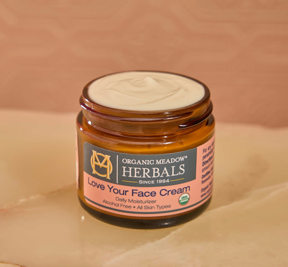 Texture closeup of Organic Meadow Herbals Love Your Face Cream – rich and creamy
