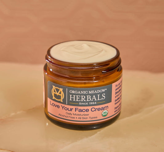 Texture closeup of Organic Meadow Herbals Love Your Face Cream – rich and creamy
