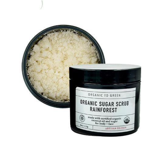 Organic To Green Rainforest Sugar Coconut Oil Scrub bottle highlights exfoliation for smooth skin