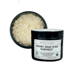 Organic To Green Rainforest Sugar Coconut Oil Scrub bottle highlights exfoliation for smooth skin