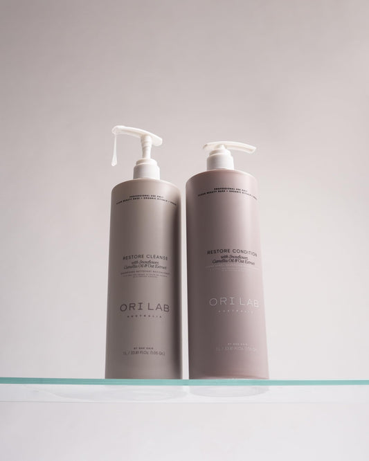 ORI LAB Restore Cleanse bottle close-up label, highlighting vegan, sulfate-free formulation.