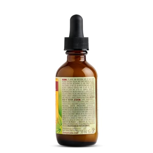 Drops of ORS Hairrestore Serum on fingers ready for scalp massage