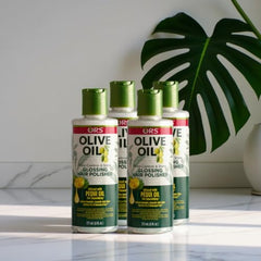 ORS Olive Oil Anti-Frizz Glossing Hair Polisher dispensing pump ready to apply.