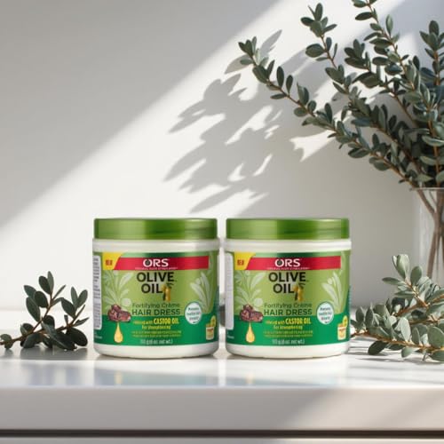 ORS Olive Oil Creme hair application by hands demonstrating smooth, non-greasy coverage