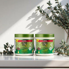 ORS Olive Oil Creme hair application by hands demonstrating smooth, non-greasy coverage
