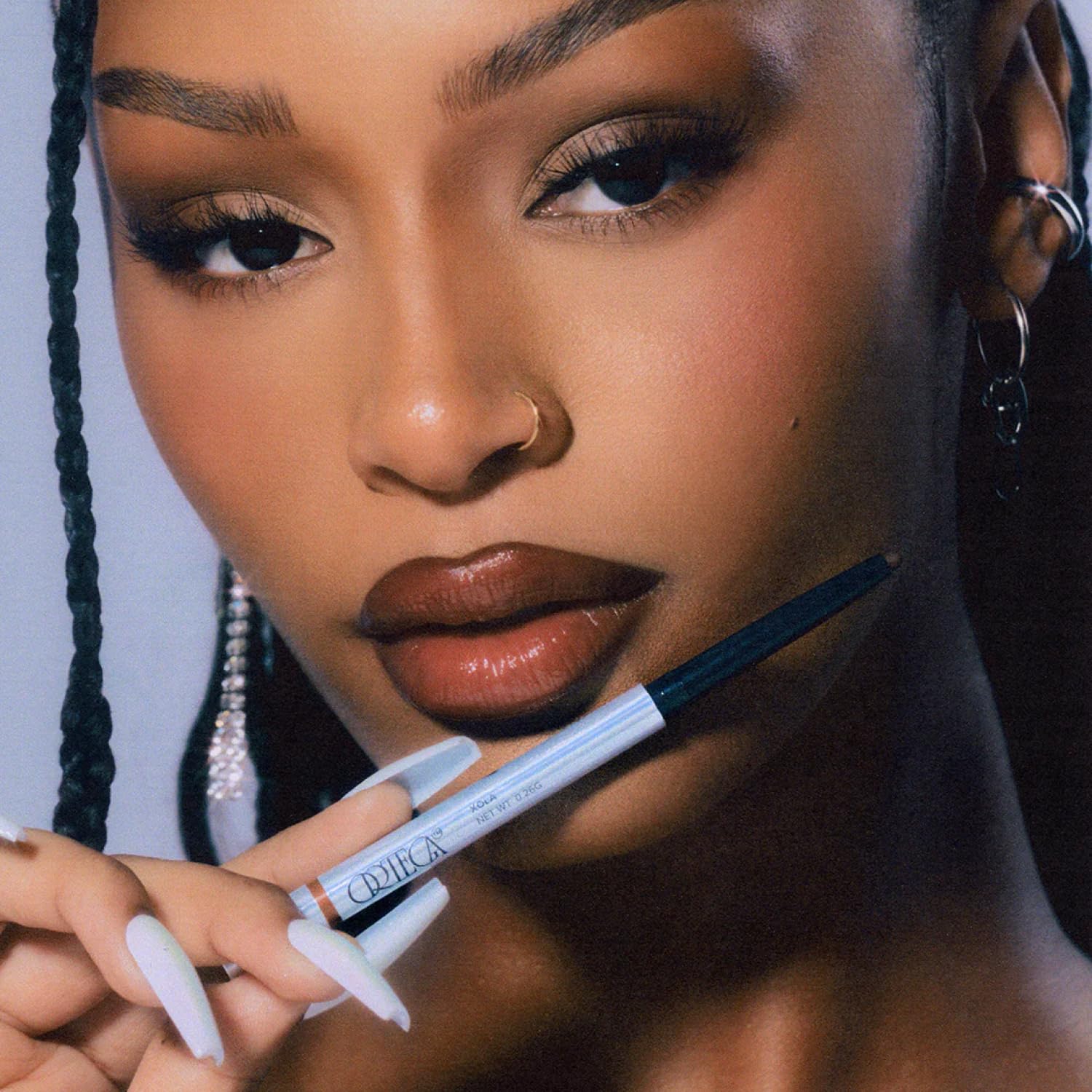 Ortega Beauty lip outlining and filling for a bold matte look.