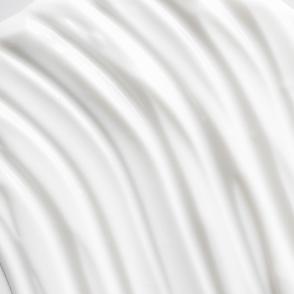 Applying OSEA Advanced Protection Face Cream on the hand demonstrates quick absorption.