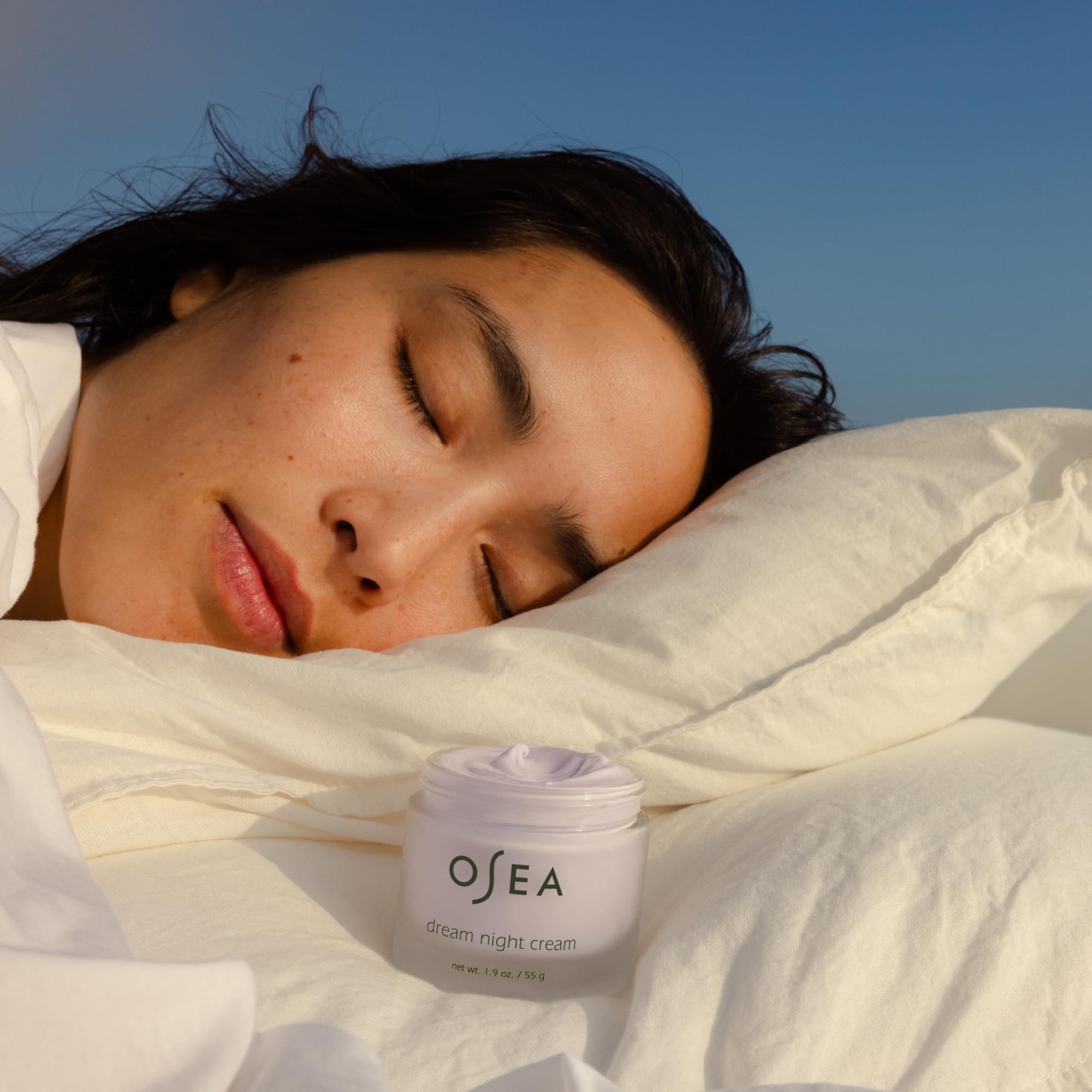 Applying OSEA Dream Night Cream for deeply hydrated, rested-looking skin