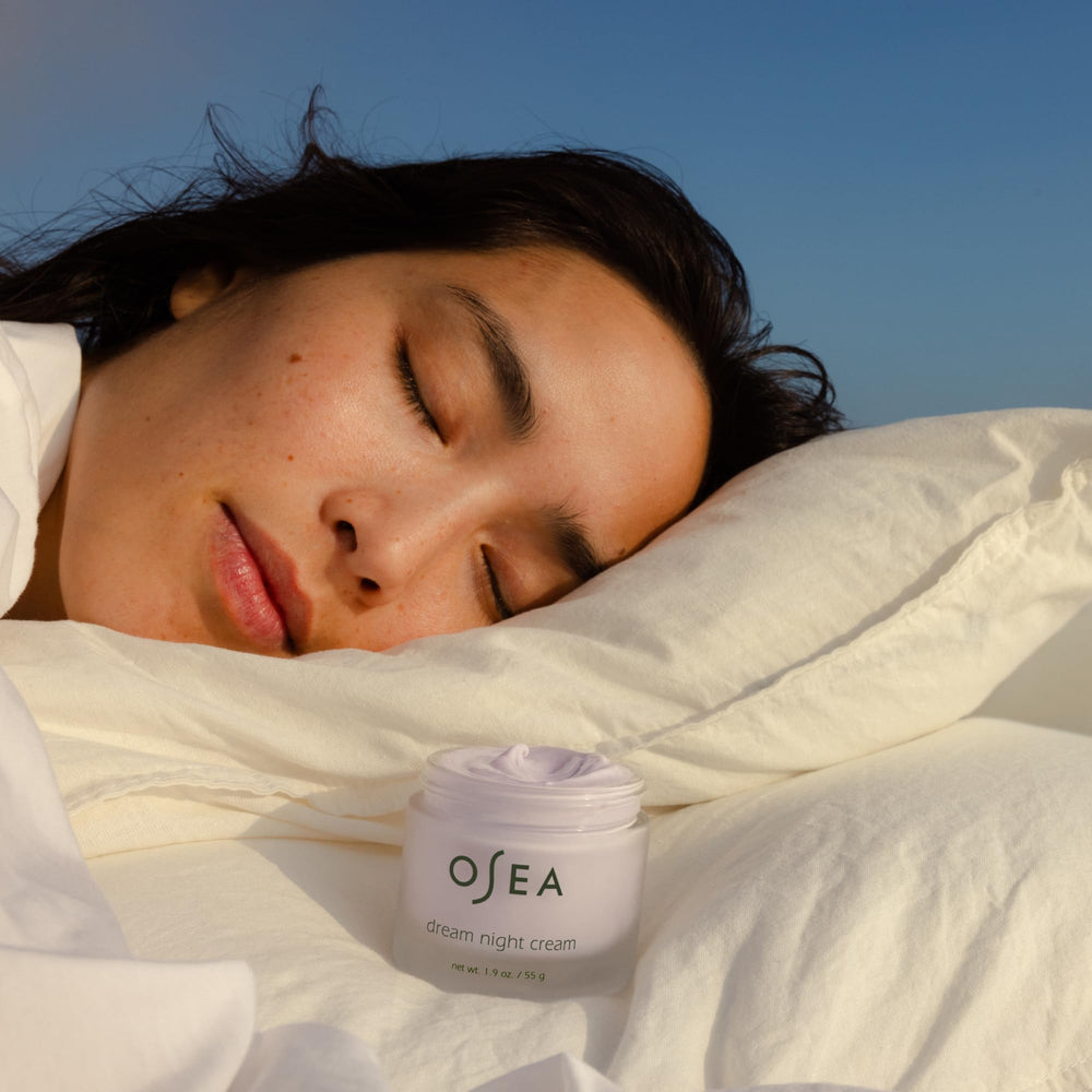 Applying OSEA Dream Night Cream for deeply hydrated, rested-looking skin