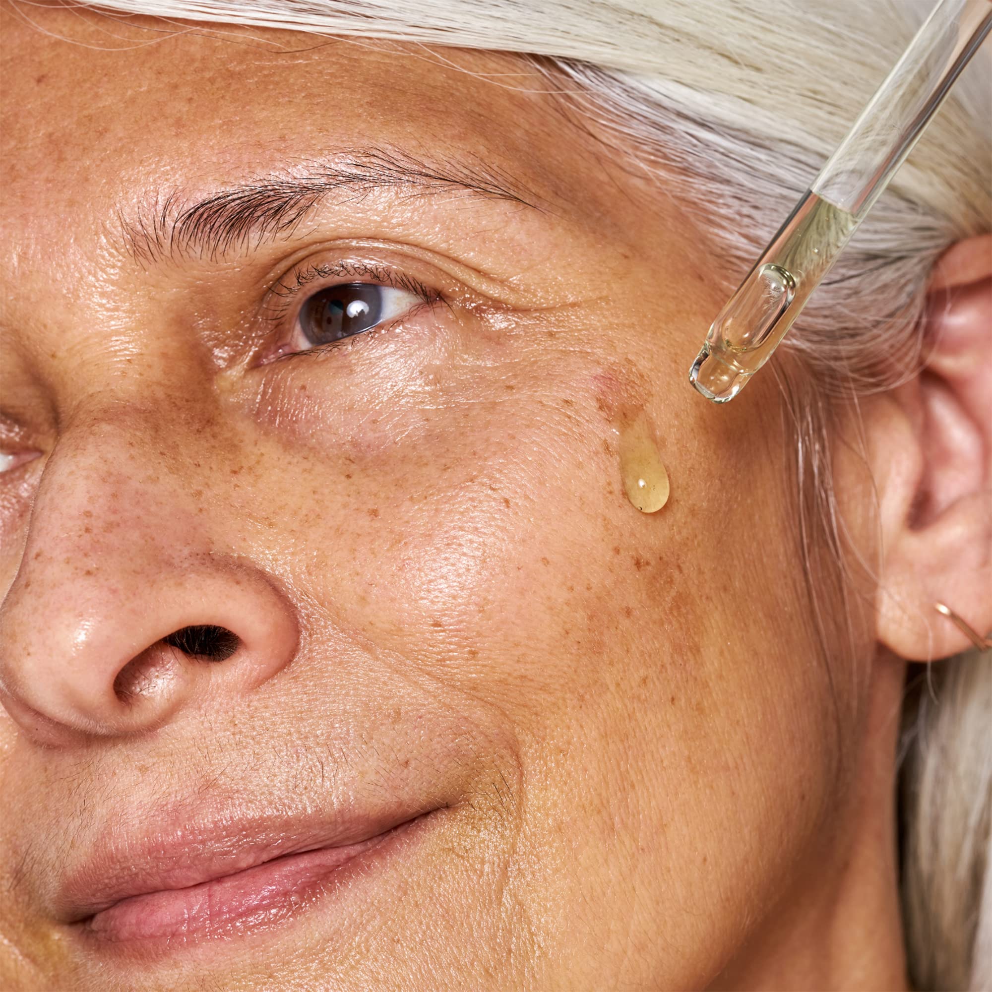 Texture close-up highlights fast-absorbing serum on skin.
