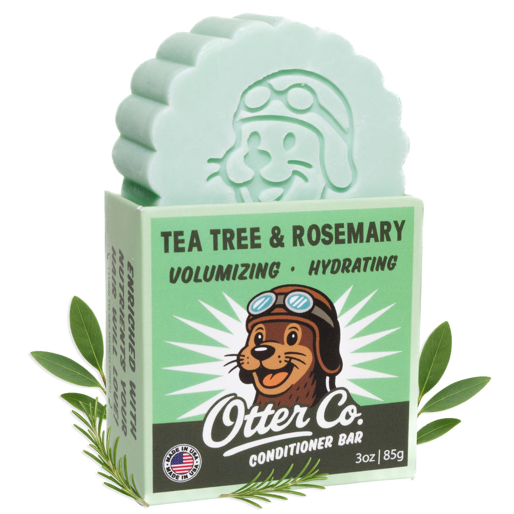 Otter Co Tea Tree & Rosemary conditioner bar packaging shows biodegradable materials for zero-waste hair care.
