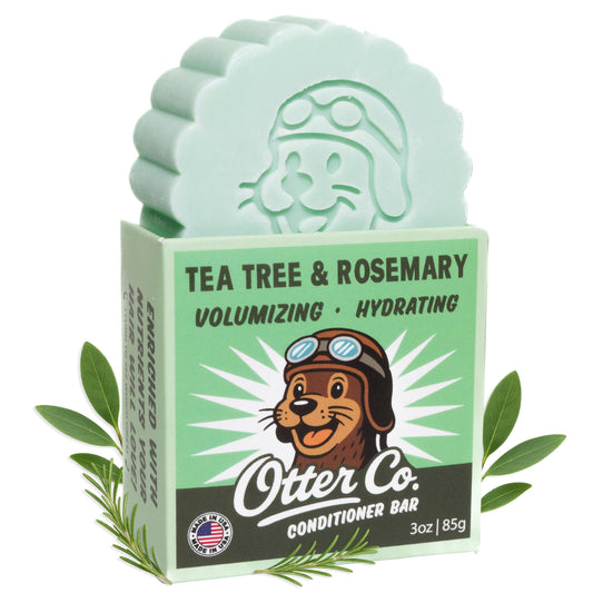 Otter Co Tea Tree & Rosemary conditioner bar packaging shows biodegradable materials for zero-waste hair care.