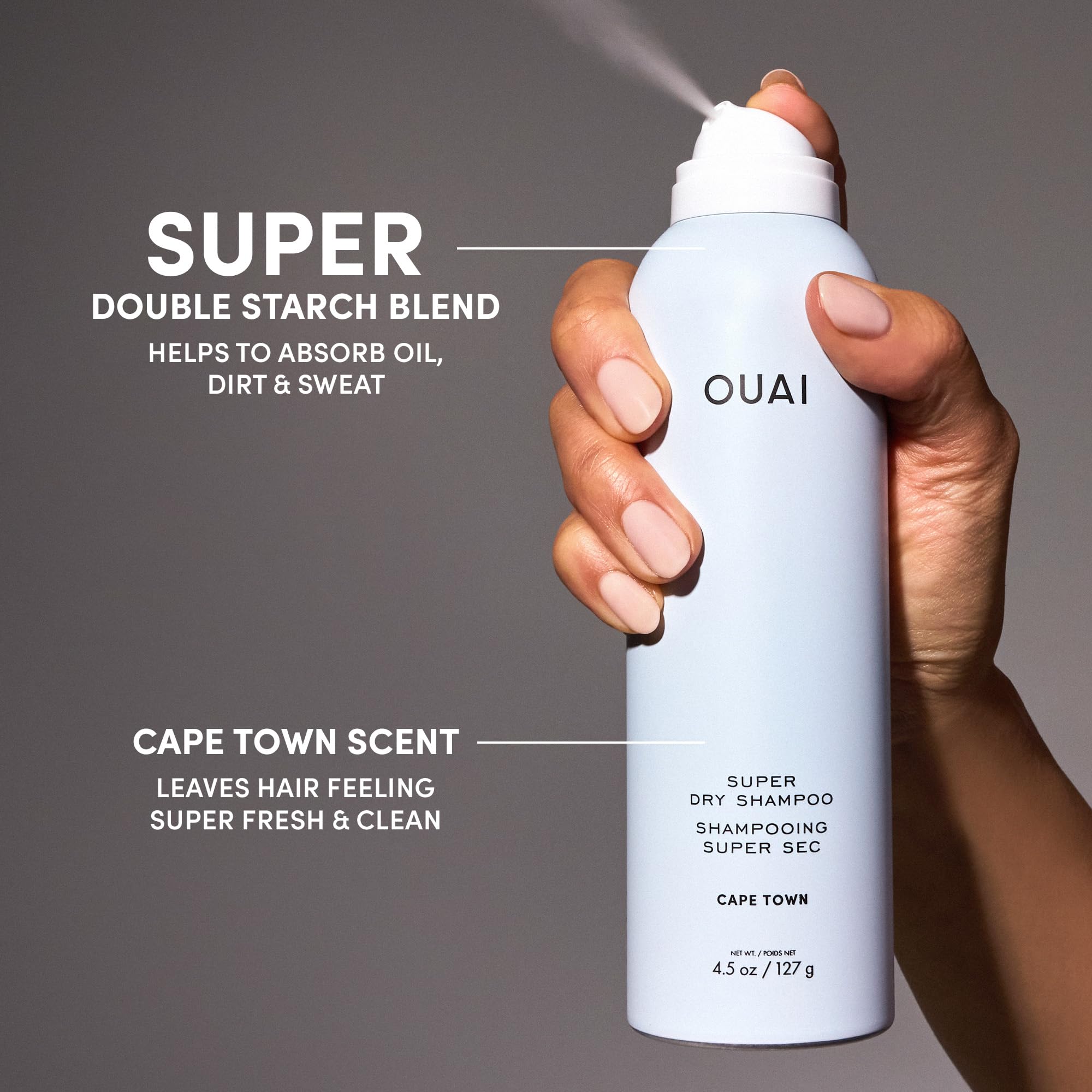 Hands applying OUAI spray to refresh roots during busy days