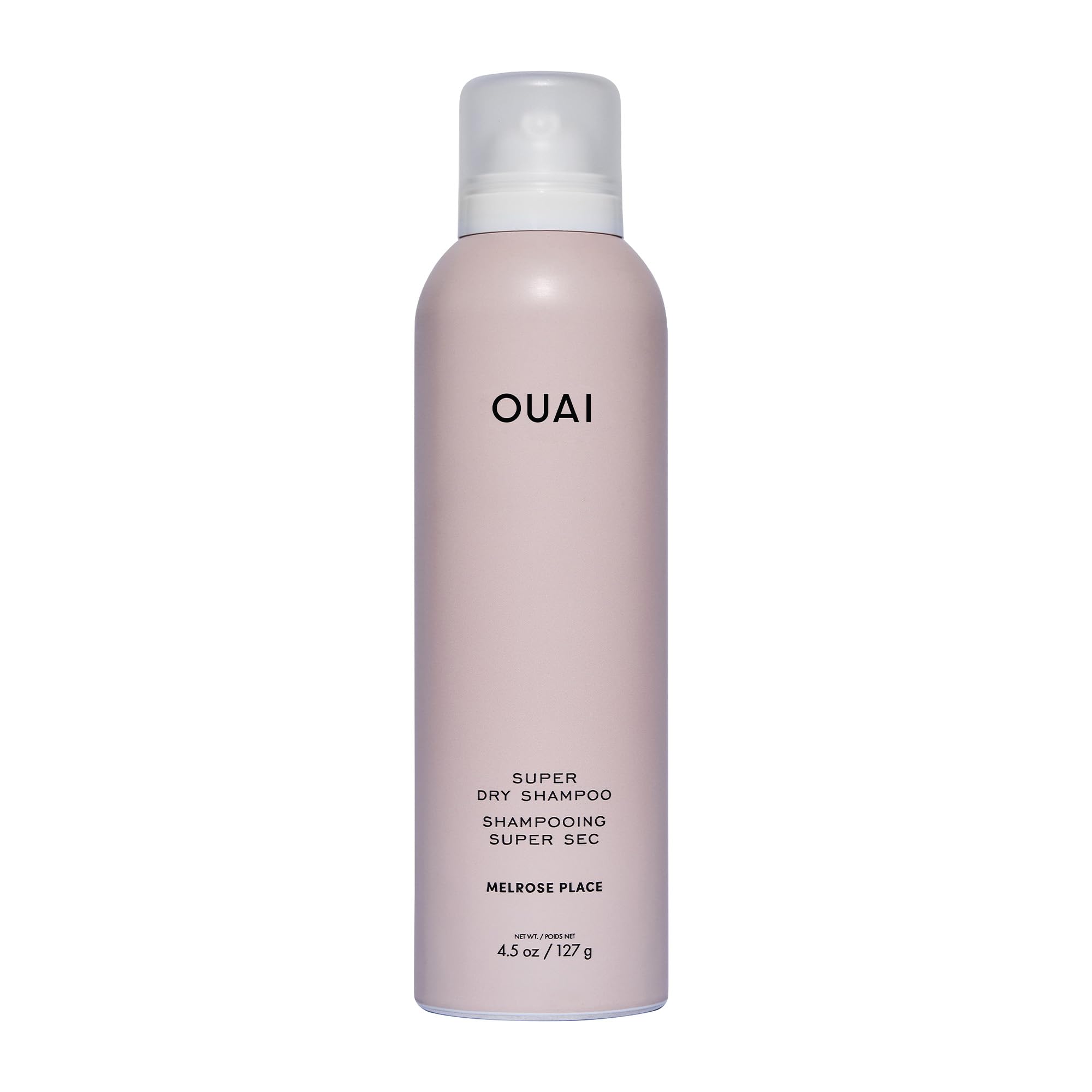 OUAI Super Dry Shampoo bottle pour showing oil absorption for between-wash refresh.