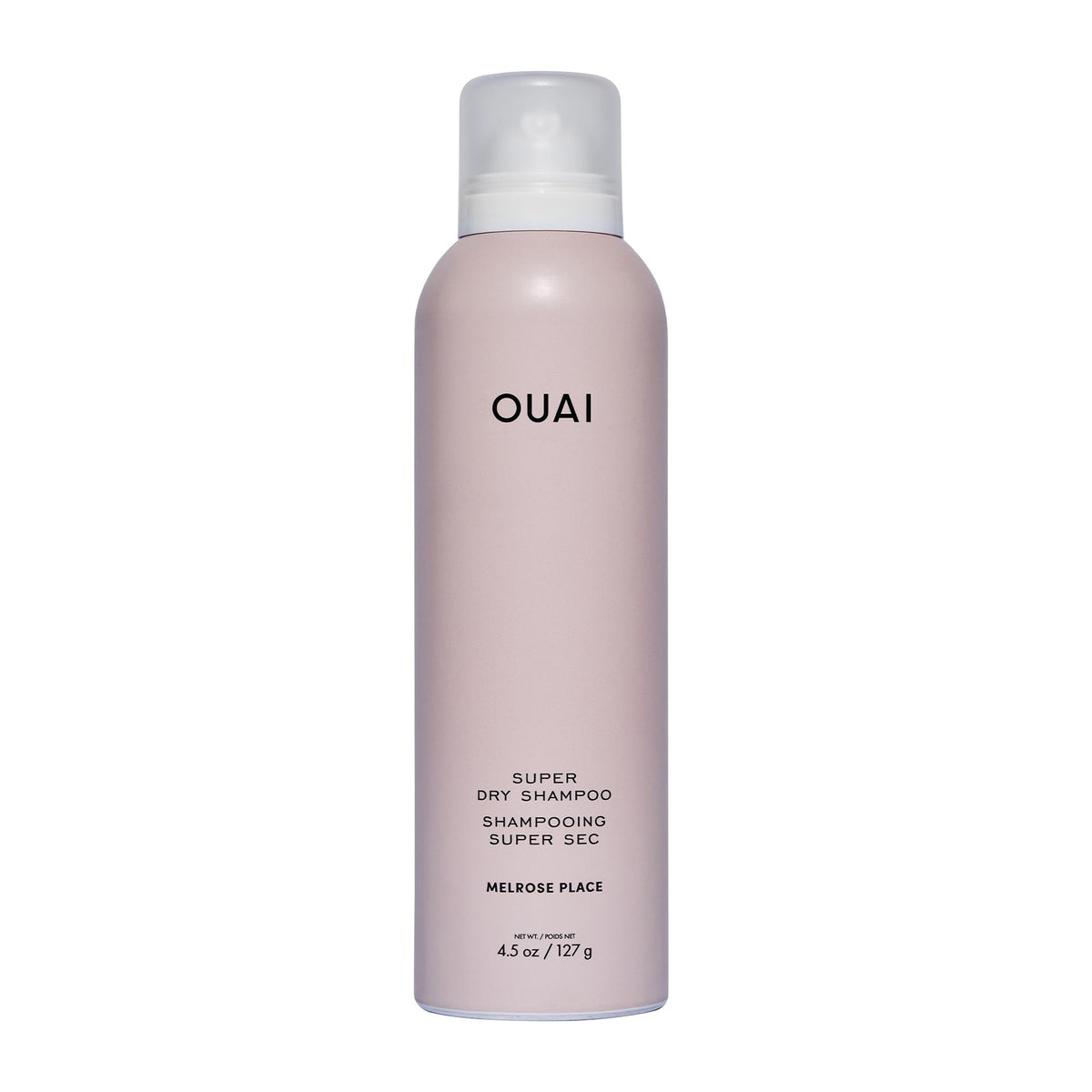 OUAI Super Dry Shampoo bottle pour showing oil absorption for between-wash refresh.