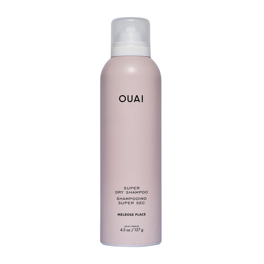 OUAI Super Dry Shampoo bottle pour showing oil absorption for between-wash refresh.