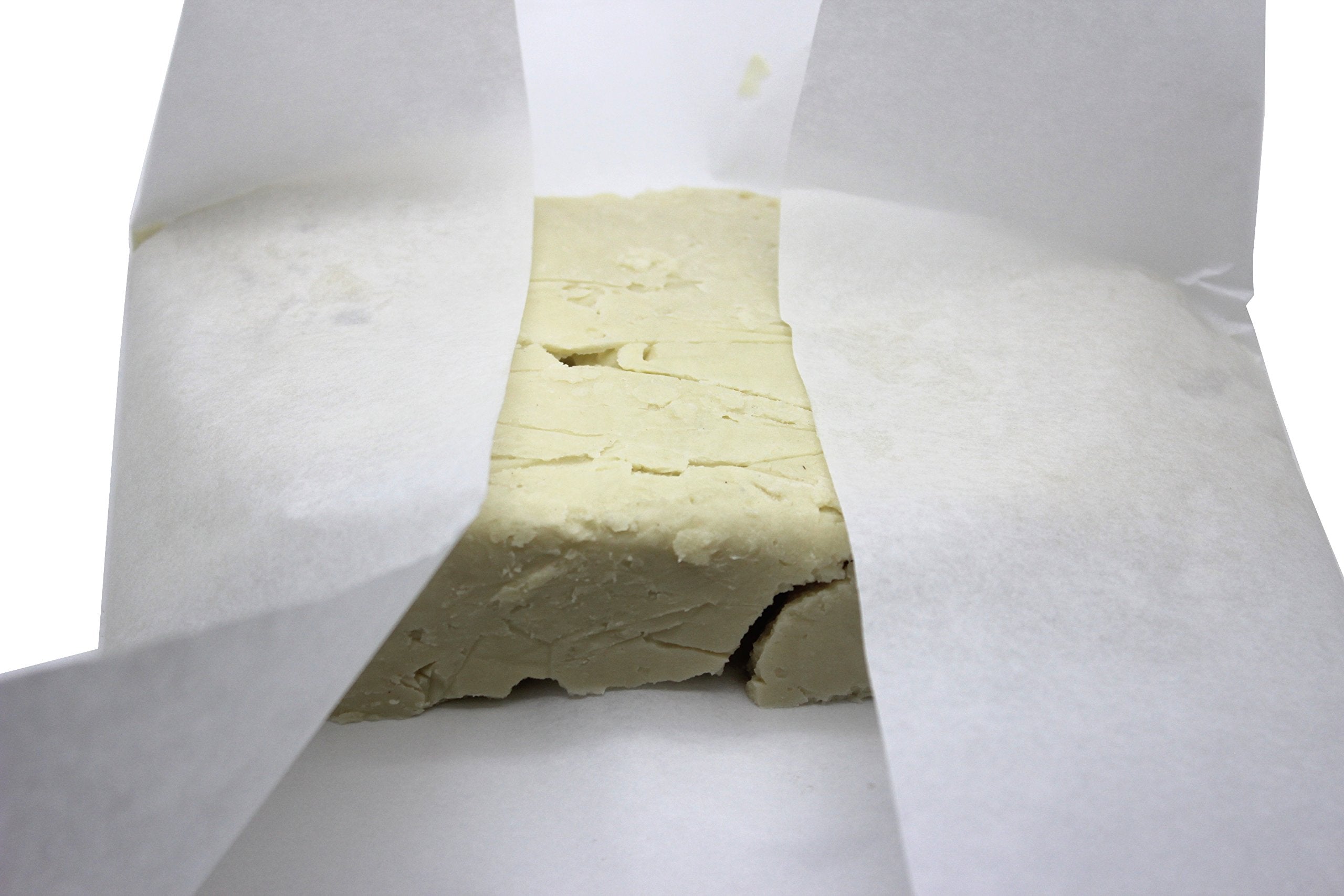 Our Earth's Secrets Ivory Shea butter applied to skin for smoothing and hydration.