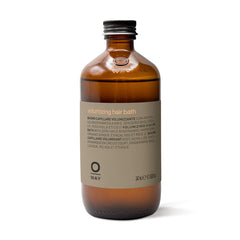 OWAY volumizing hair bath bottle demonstrates lift and body for fine hair