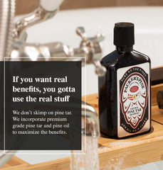 Packer's Pine Tar Conditioner bottle close-up for nourishing hair care.