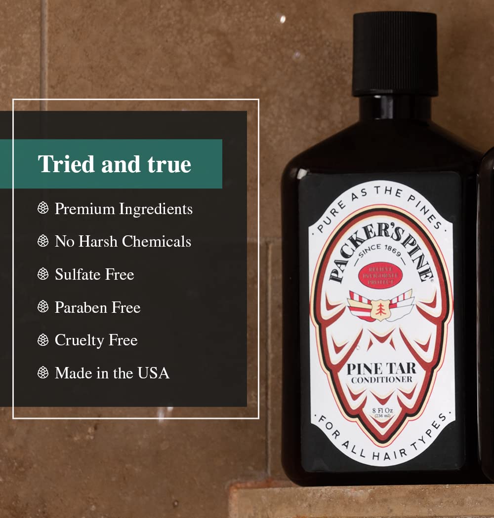 Packer's Pine Tar Shampoo bottle in a shower setting with mist.