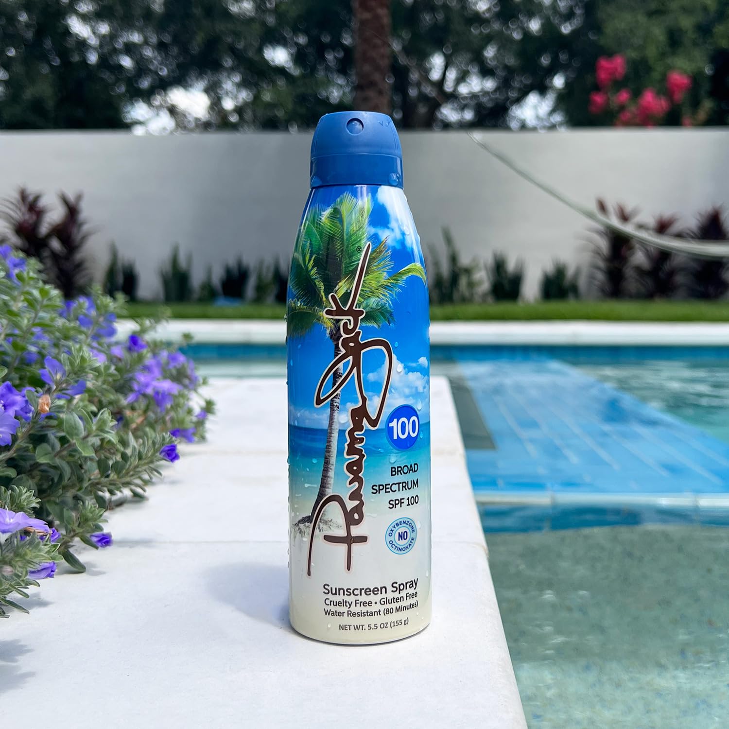 Panama Jack spray bottle applying sunscreen with a fine mist