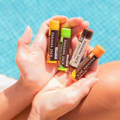 Close-up of applying Panama Jack lip balm for smooth, non-waxy coverage.