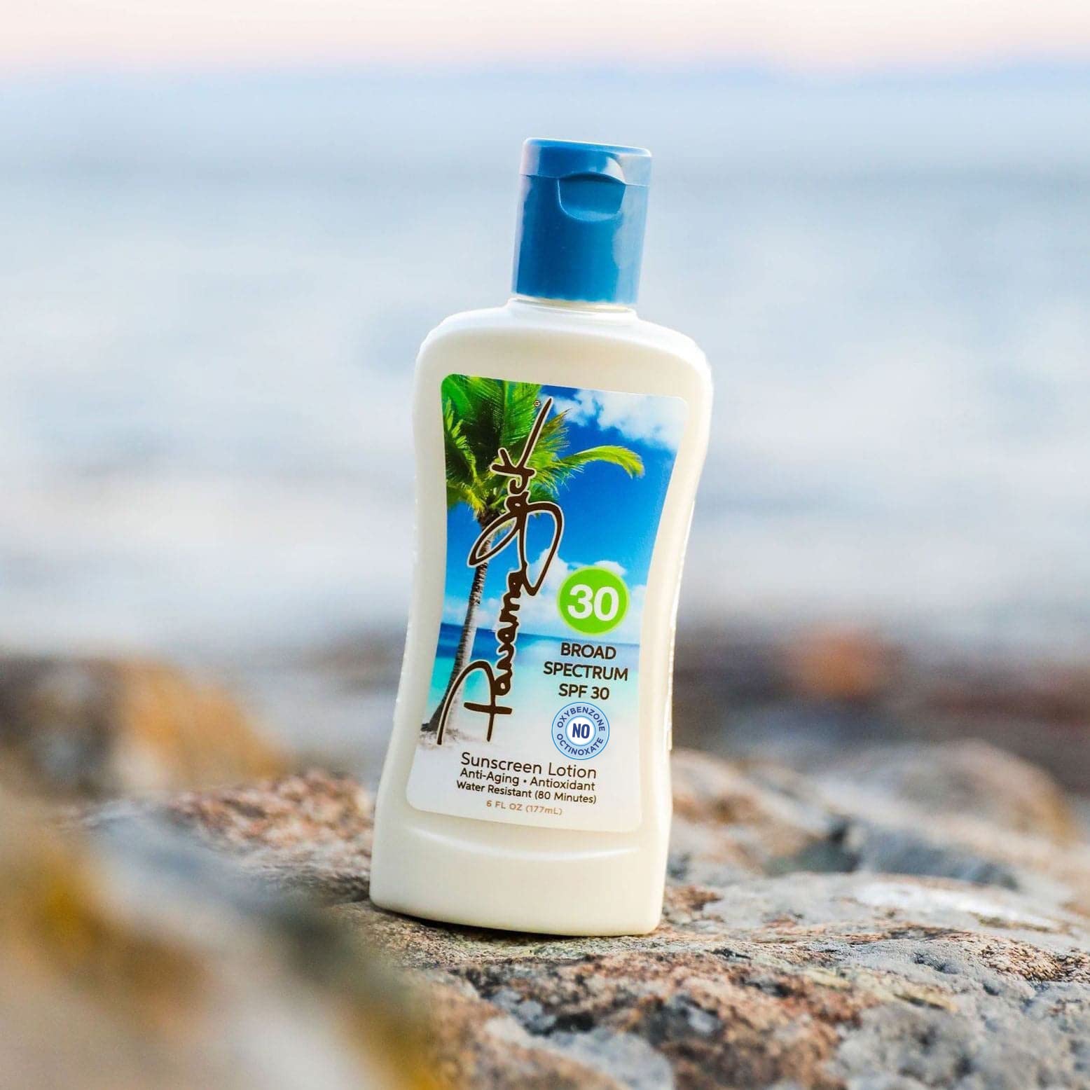 Panama Jack Sunscreen on towel after water activity, illustrating water resistance.